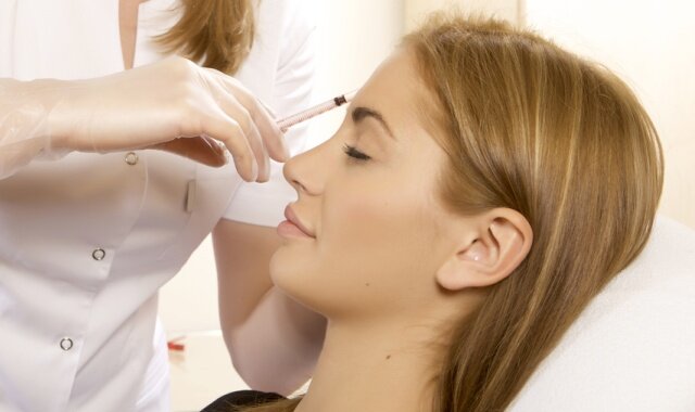 young beautiful woman having an injection mesotherapy